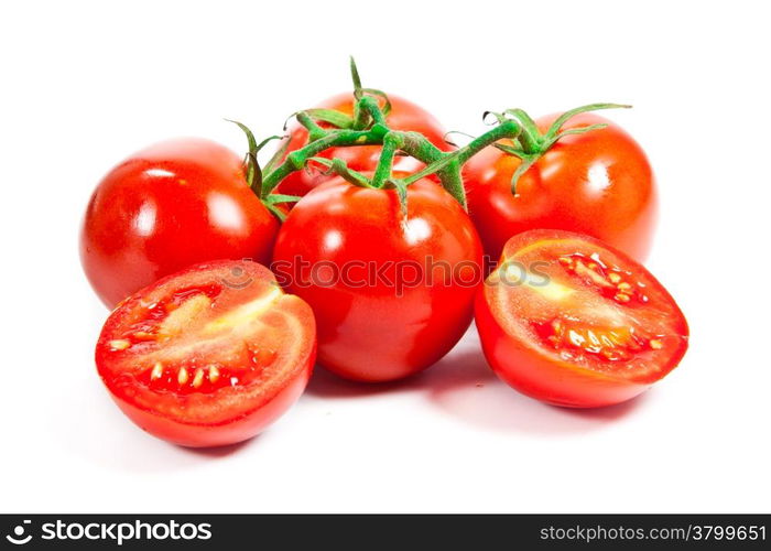 Closeup of tomatoes on the vine isolated on white