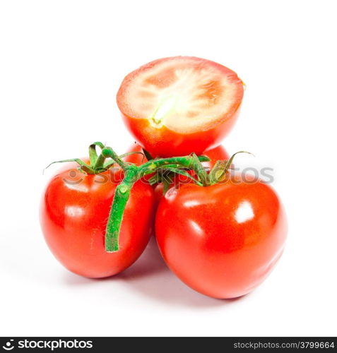 Closeup of tomatoes on the vine isolated on white