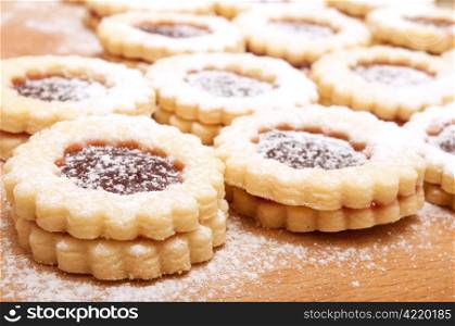 Closeup of Traditional Linzer Cookies on Wooden Board