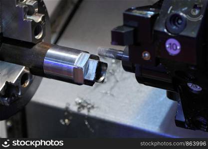 Closeup of turning and drilling machine at work.
