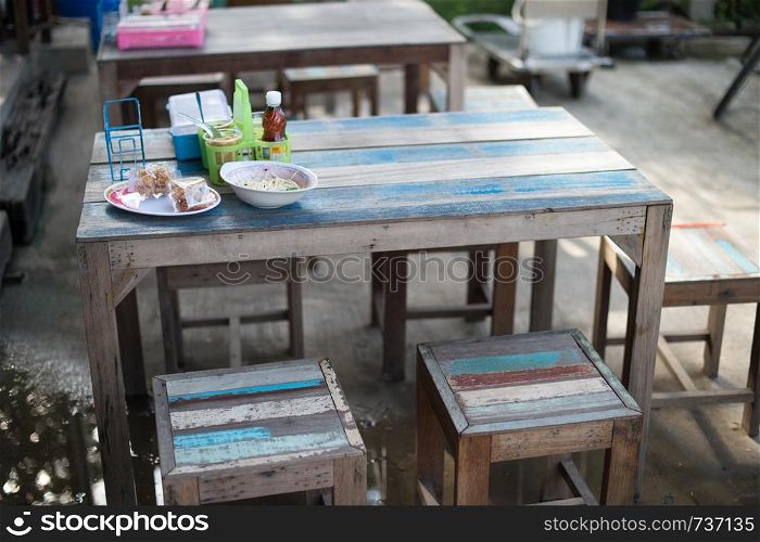 closeup of vintage table and stool set in food shop