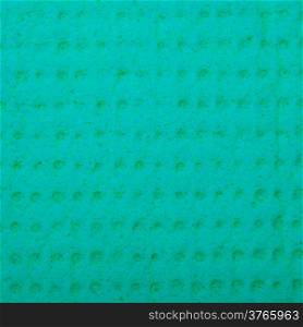 Closeup of vivid turquoise sponge as background texture pattern. Macro. Square format.