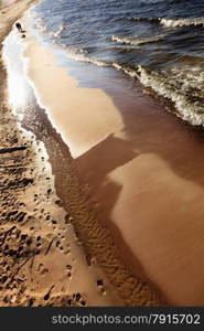 Closeup of water waves at sandy beach. Sea or ocean. Relax in resort.