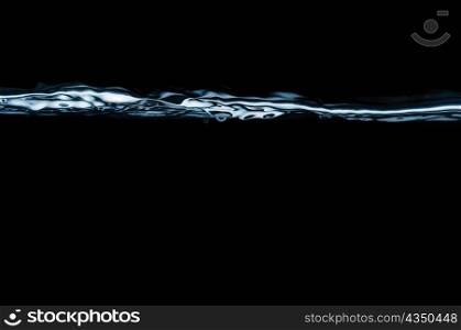 closeup of water waves isolated on black