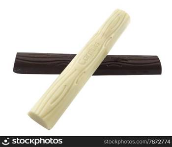 Closeup of white and black chocolate bar isolated on white.