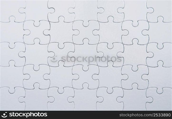 Closeup of white puzzle background.