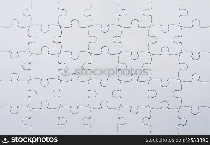 Closeup of white puzzle background.