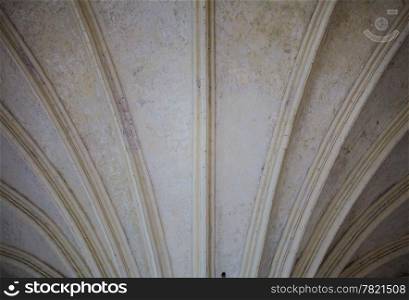 Closeup of white vault ceiling supported by old columns as architectural part. Ancient style of architecture.