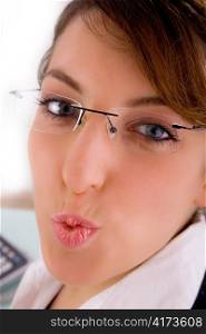 closeup of woman corporate offering kiss on an isolated background