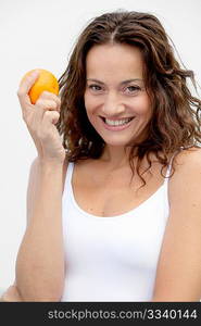 Closeup of woman eating an orange