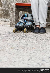 Closeup of woman girl with roller skates blades outdoor.. Woman with roller skates outdoor.