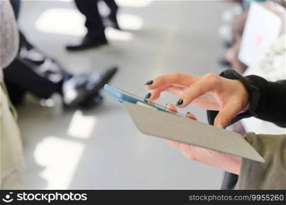 closeup of woman hand  using digital tablet in skytrain