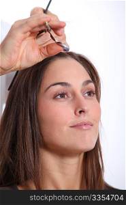 Closeup of woman having an haircut