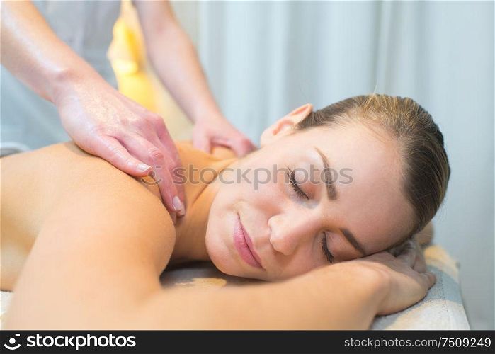 closeup of woman having back massage