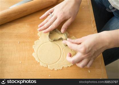 Closeup of woman using cookie cutter