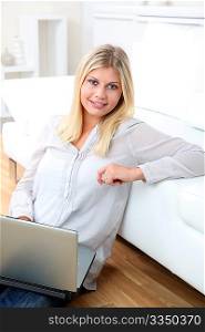 Closeup of woman websurfing on internet at home
