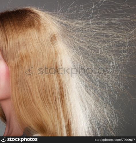 Closeup of woman with static blonde hair. . Closeup of woman girl with static blonde long hair.