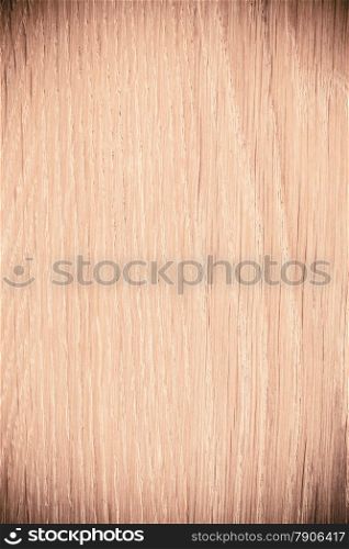 Closeup of wood. Brown wooden plank as background texture backdrop with vingette. Macro