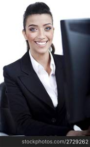Closeup of young business woman infront of the computer over white background