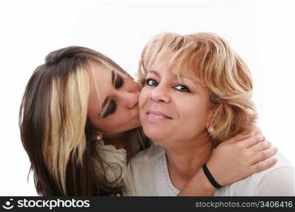 Closeup of young girl kissing her mom isolated on a white background