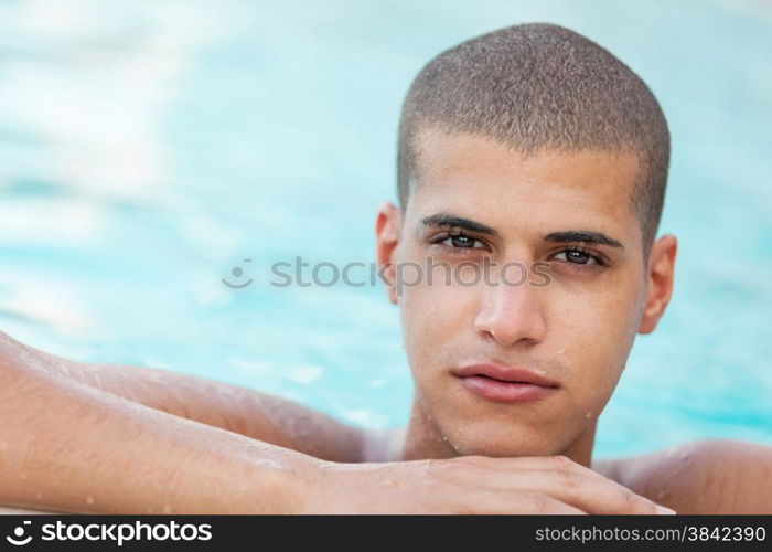 Closeup of young man in the pool