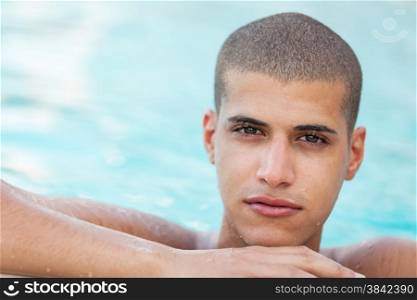 Closeup of young man in the pool