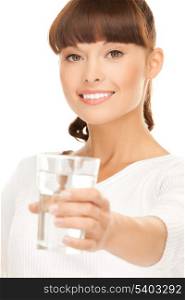closeup of young smiling woman offering glass of water