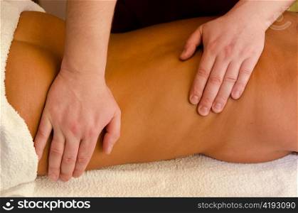 closeup of young woman getting a back massage