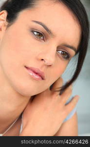 Closeup of young woman pensive