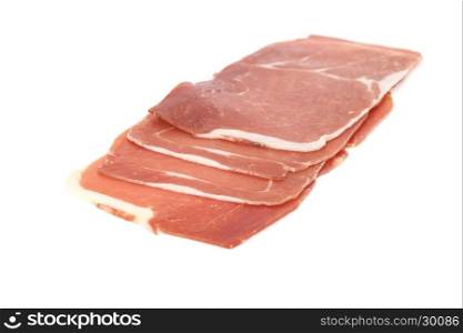 closeup on a piece of spanish serrano ham, isolated on white