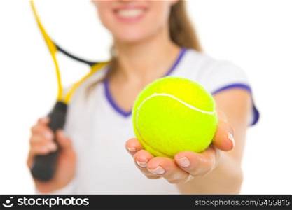 Closeup on ball in hand of female tennis player