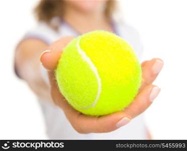 Closeup on ball in hand of tennis player