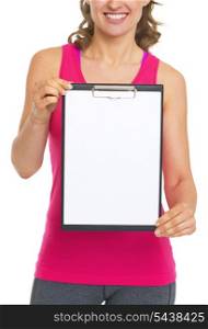 Closeup on blank clipboard in hand of fitness woman