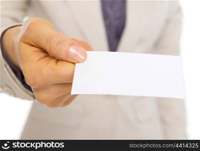 Closeup on business card giving by business woman