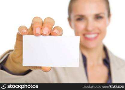 Closeup on business card in hand of smiling business woman