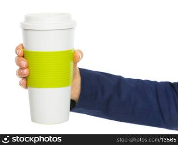 Closeup on business woman hand holding cup of hot beverage