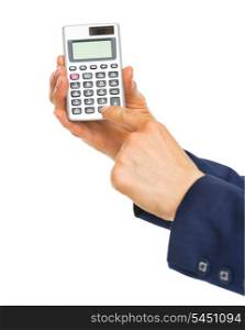 Closeup on business woman hands using calculator