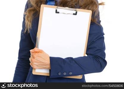 Closeup on business woman holding clipboard with blank paper sheet