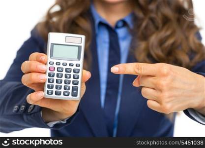 Closeup on business woman pointing on calculator