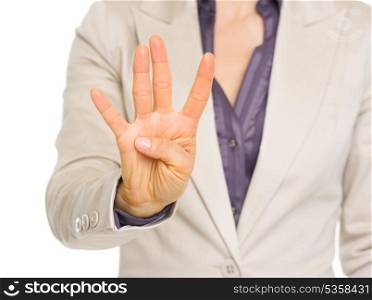 Closeup on business woman showing four with fingers
