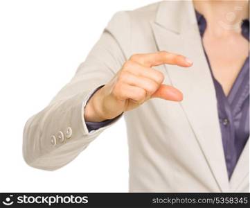 Closeup on business woman showing small risks gesture