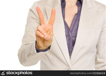 Closeup on business woman showing two with fingers