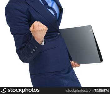 Closeup on business woman with folder rejoicing success