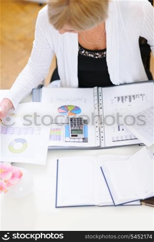 Closeup on business woman working at office table