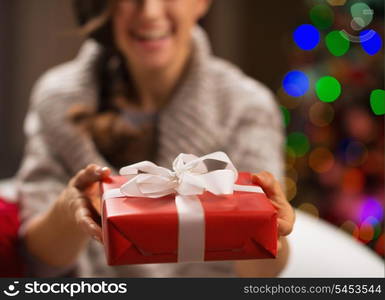 Closeup on Christmas gift box in woman hands