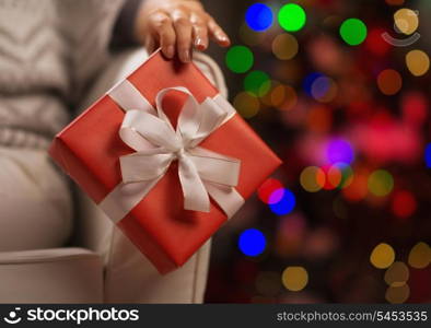 Closeup on Christmas present box in woman hand