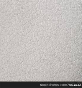 Closeup on cracked white leather texture background.