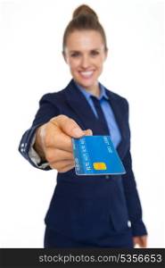 Closeup on credit card in hand of smiling business woman