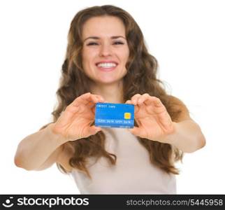 Closeup on credit card in hands of happy young woman
