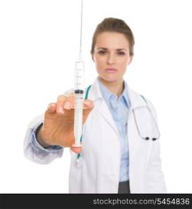 Closeup on doctor woman holding syringe